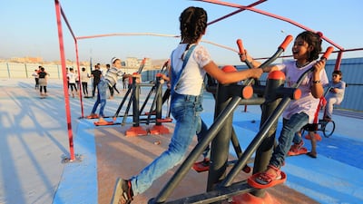 Displaced Iraqi children from the minority Yazidi community, who fled the Iraqi town of Sinjar, play at Sharya camp on the outskirts of Duhok governorate, in northern Iraq. Reuters.
