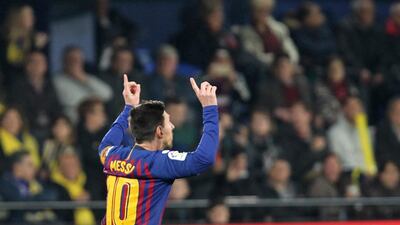 Barcelona forward Lionel Messi celebrates after scoring his side's third goal. AP Photo