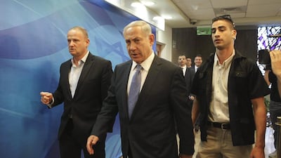Israeli prime minister Benjamin Netanyahu, centre, arrives at a cabinet meeting to discuss public disorder in Jerusalem on Tuesday. Dan Balilty / Reuters