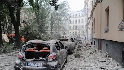 Wrecked vehicles and debris in the street. Around 35 houses and 50 cars were damaged. EPA