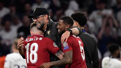 Klopp celebrates with Alberto Moreno and Georginio Wijnaldum. AFP