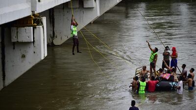 More than 300 people have taken up a government offer of a bus ride home to their country / AFP / Pedro Pardo