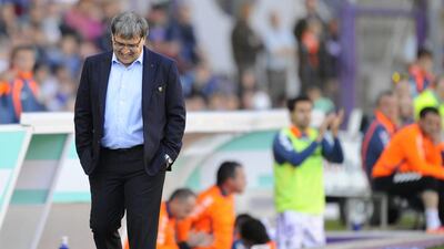 Barcelona's coach Gerardo Martino can only grimace and stare at his feet as they fall to Real Valladolid 1-0 in their Primera Liga match on March 8, 2014. Israel L Murillo / AP Photo