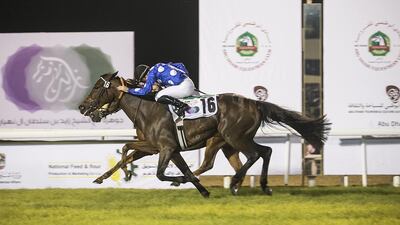 Jockey Olivier Peslier rides Kalino to victory in the sixth race on the evening, the HH Sheikha Fatima bint Mubarak Apprentice Jockey Championship, at the Abu Dhabi Equestrian Club. Mona Al Marzooqi / The National