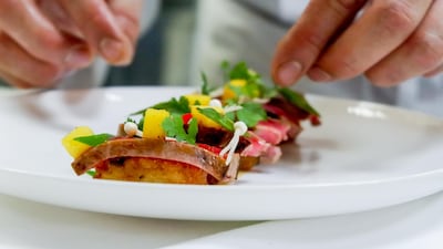 Beef tataki with crispy rice; Dh80