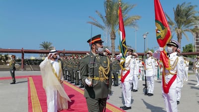 Sheikh Mohammed inspects a ceremonial guard.