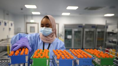A lab technician works at the Amazon Covid-19 testing lab in Worsley, Britain. Reuters