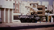 An armoured vehicle guards key installations in Dubai at the start of the Gulf War on August 17, 1990. Getty Images