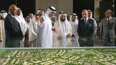 Dr Sheikh Sultan bin Mohammed Al Qasimi, the Ruler of Sharjah, takes a look at a scale model of the Al Zahia Projects during the Sharjah FDI Forum on Wednesday. Satish Kumar / The National