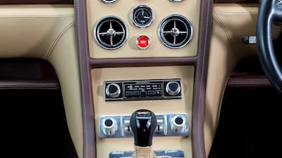 The Jensen Interceptor R features a new dashboard, with toggle switches, electric windows and mirrors, infotainment with Bluetooth connectivity, and a big red starter button