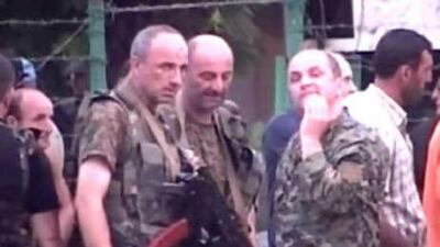 A Russian NTV channel television grab shows Abkhaz soldiers standing on a street in the Georgian breakaway Abkhazia region in Sukhumi yesterday. Rebel forces in Abkhazia launched a new attack on Georgian troops today in a sliver of the breakaway region held by Tbilisi, Interfax news agency reported, citing Abkhaz separatists.