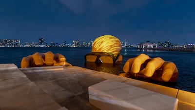 The giant Emerging Man sculpture – the head alone is 8m in diameter – of a diver emerging from Yas Bay on Yas Island. It was created by Fathima Mohiuddin, aka Fatspatrol, an Indian Canadian artist who grew up in UAE. Victor Besa / The National
