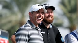 Rory McIlroy with Shane Lowry on day one of the Dubai Invitational. Getty Images
