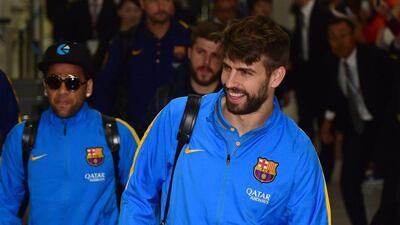 Barcelona's Gerard Pique shown arriving in Japan on Monday for the Club World Cup. Yoshikazu Tsuno / AFP / December 14, 2015