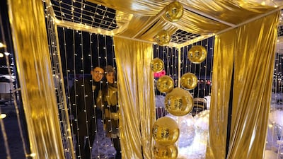 People look at Christmas illuminations in Almaty, Kazakhstan. Reuters