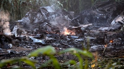 Smouldering debris at the crash near the village of Palaiochori, west of Kavala International Airport. AP