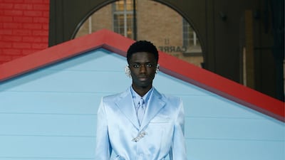 For his last collection, Virgil Abloh created a baby blue silk jacket and shorts look, finished with a jewel and high top trainers. Photo: Louis Vuitton