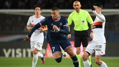 Kylian Mbappe runs with the ball during the Ligue 1 match between PSG and Lorient. AFP