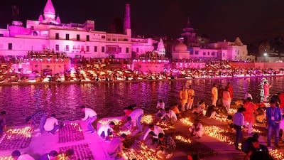 People light lamps on the banks of the river Sarayu to celebrate Diwali in Ayodhya, India. AP