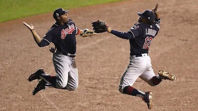 Francisco Lindor and Rajai Davis celebrate after defeating the Chicago Cubs 1-0 in Game 3 of the World Series. Elsa / Getty Images