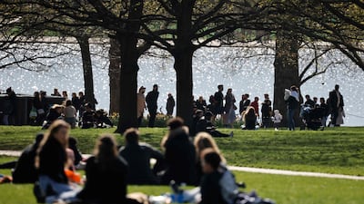 People congregate in Hyde Park in central London. AFP