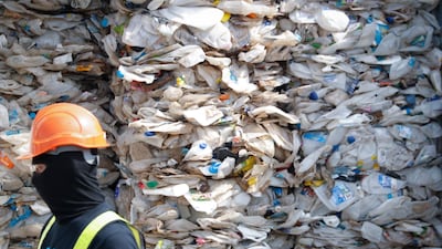 A container is filled with plastic waste from Australia, in Port Klang, Malaysia. AP