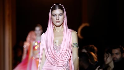 A cowled, hooded dress in soft pink at Zuhair Murad. Getty Images