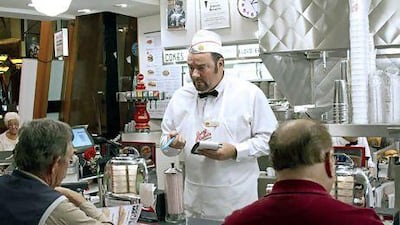 John Fuller, the president and chief executive of Johnny Rockets, in a scene from the television series Undercover Boss . PRNewsFoto / Johnny Rockets, Studio Lambert