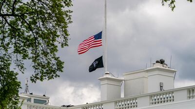 The American flag files at half-staff above the White House in Washington. AP Photo