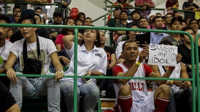 Fans cheer on Philippines Basketball Association teams during an official league game in Dubai on Thursday. Antonie Robertson / The National