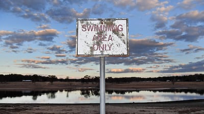 A swimming area only sign is seen at the near-empty Storm King dam near Stanthorpe in regional Queensland. AFP