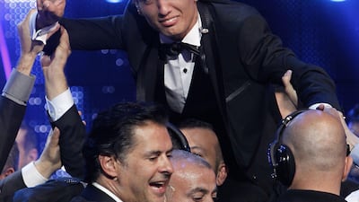 Palestinian singer Mohammed Assaf cries of joy as he celebrates after winning the "Arab Idol" singing contest in Zouk Mosbeh, north of the Lebanese capital Beirut, early on June 23, 2013. Jubilant Palestinians took to the streets in their thousands after Mohammed Assaf won the pan-Arab singing contest that has had millions of viewers fixed to their TV screens since March. AFP PHOTO/ANWAR AMRO *** Local Caption *** 405374-01-08.jpg