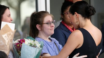 The duchess hugged several young fans as she entered Mothers 2 Mothers. Reuters