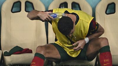 Cristiano Ronaldo pours water on his head. AFP