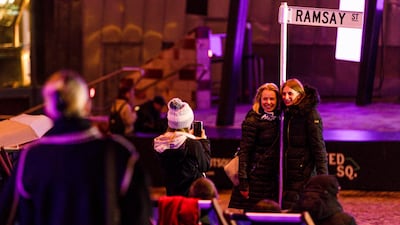 Emotional fans took photos in front on a Ramsay Street sign, the fictional road where the characters live.