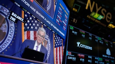 A press conference featuring Federal Reserve Chairman Jerome Powell appears on a monitor at the New York Stock Exchange. AP