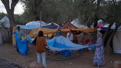 A family erect a shelter in Amizmiz after being displaced by the quake. Getty Images