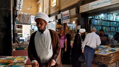 Iraqis check out books at the Howeish book market in the holy city of Najaf. AFP