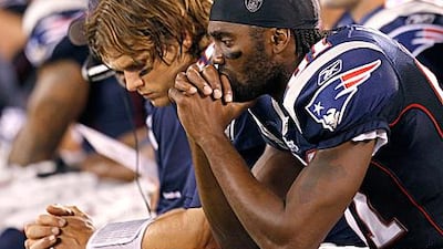 Randy Moss, right, with Tom Brady, the New England Patriots quarterback, has been traded to the Minnesota Vikings.