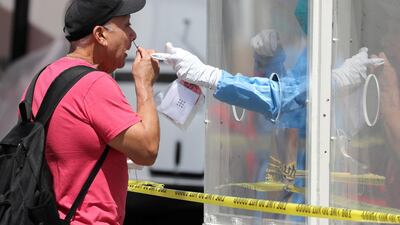 A man is tested for coronavirus disease (COVID-19) at a Los Angeles fire department testing station for the homeless on Skid Row, in Los Angeles, California, U.S. REUTERS