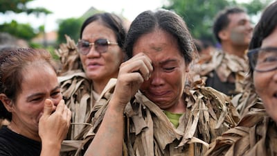 Participants in the Taong Putik, or mud people, festival in Bibiclat