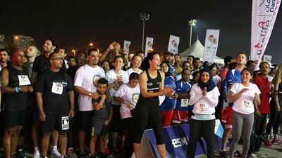 Team members cheer their colleagues on. Pawan Singh / The National