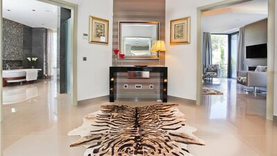 The traditional Portuguese exterior moves into a modern and simple interior with open-plan, spacious rooms. Courtesy Kensington Exclusive Properties