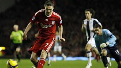 Liverpool's Robbie Keane rounds WBA goalkeeper Scott Carson for his second goal of the game.