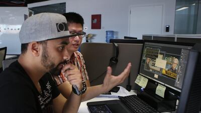Xie Jun and Hicham Habchi work on CSI: Hidden Crimes at the Ubisoft Abu Dhabi Studio. Delores Johnson / The National