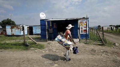 The strike has caused broader economic damage to local South African communities including Marika, above, with as much as 28,000 miner on strike since January. Siphiwe Sibeko / Reuters