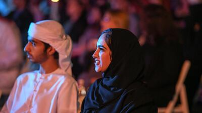 Audience members immersed in one of the series of performance held at Umm Al Emarat Park.