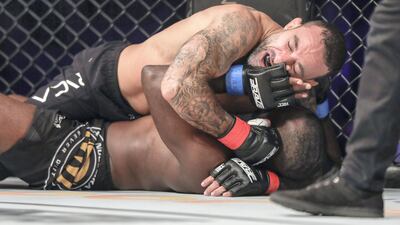 Alex Nacfur gets on top of Dwight Brooks in the first round of their super lightweight contest.