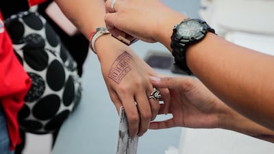 A tourist gets stamped on entry to Boracay.