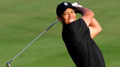 Tiger Woods tees off at the tenth hole during this year's Dubai Desert Classic at the Emirates Golf Club.